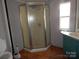 Bathroom featuring a shower stall, linoleum flooring, and a white vanity at 335 Lake Landing Dr, Salisbury, NC 28146
