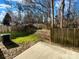 Fenced-in backyard with a mix of grass and leaves at 4070 Shasta Cir, Clover, SC 29710