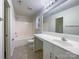 Well-lit bathroom with a large vanity, a full-size mirror, and a shower-tub combo at 4070 Shasta Cir, Clover, SC 29710
