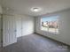 Spacious bedroom with carpeting and large window for ample natural light at 4070 Shasta Cir, Clover, SC 29710