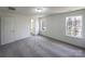 Clean, neutral bedroom with large windows offering plenty of natural light and cozy carpet flooring at 4070 Shasta Cir, Clover, SC 29710