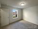 Carpeted bedroom with natural light and a view to the street at 4070 Shasta Cir, Clover, SC 29710