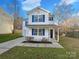 Charming two-story home with blue shutters and a cozy front porch, perfect for enjoying quiet evenings at 4070 Shasta Cir, Clover, SC 29710