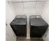 Laundry room with shelving and updated washer and dryer at 4070 Shasta Cir, Clover, SC 29710