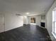 Open living room features tile floors, fireplace, and backyard access at 4070 Shasta Cir, Clover, SC 29710