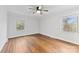 Sunlit bedroom boasts hardwood floors, and generous natural light from double hung windows at 410 Deerwood Dr, Gastonia, NC 28054