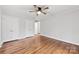 Bright bedroom with hardwood floors, featuring double closets for ample storage space at 410 Deerwood Dr, Gastonia, NC 28054
