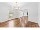 Formal dining room featuring hardwood floors, large window and classic trim at 410 Deerwood Dr, Gastonia, NC 28054