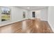 Bright living room with hardwood floors, large windows, and an inviting entryway at 410 Deerwood Dr, Gastonia, NC 28054