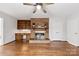 Warm living room with brick fireplace and hardwood floors at 410 Deerwood Dr, Gastonia, NC 28054