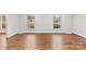 Inviting living room with hardwood floors and natural light from two large windows at 410 Deerwood Dr, Gastonia, NC 28054
