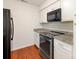 Updated kitchen with stainless steel appliances, granite countertops, and white subway tile backsplash at 5011 Sharon Rd # J, Charlotte, NC 28210