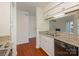 Bright kitchen featuring granite counters, stainless steel sink and appliances and an open view to the living area at 5011 Sharon Rd # J, Charlotte, NC 28210