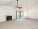 Bright living room featuring a fireplace, sliding glass doors, and neutral carpet for a comfortable space at 5011 Sharon Rd # J, Charlotte, NC 28210