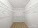 Spacious walk-in closet with ample shelving for organized storage at 5084 Parkview Way, Matthews, NC 28104