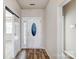 Bright foyer with wood-look floors and a view of the front door at 5203 Coffeeberry Ln, Charlotte, NC 28227