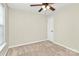 Bright bedroom with a ceiling fan, a large window, and a closet; cozy and well-lit space at 5323 Dewmorn Pl, Charlotte, NC 28269