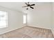 Bedroom with carpet, neutral walls, a window, and a ceiling fan at 5323 Dewmorn Pl, Charlotte, NC 28269