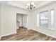 The light-filled dining area features wood floors and neutral paint, creating an inviting atmosphere at 5323 Dewmorn Pl, Charlotte, NC 28269