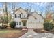 Charming two-story home featuring a two-car garage, landscaped yard, and inviting front entrance at 5323 Dewmorn Pl, Charlotte, NC 28269