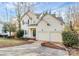 Charming two-story home featuring a two-car garage, landscaped yard, and inviting front entrance at 5323 Dewmorn Pl, Charlotte, NC 28269