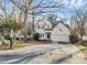 Charming two-story home featuring a two-car garage, landscaped yard, and inviting front entrance at 5323 Dewmorn Pl, Charlotte, NC 28269