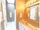 Bathroom with neutral walls, white vanity, large framed mirror, and shower/tub combination at 720 9Th Nw Ave, Hickory, NC 28601