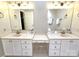 Bathroom with double vanity, white cabinets, and neutral walls at 720 9Th Nw Ave, Hickory, NC 28601