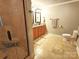 This bathroom is equipped with double sinks, a tile floor, and glass-enclosed shower at 720 9Th Nw Ave, Hickory, NC 28601