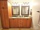 Bathroom with double sinks and framed mirrors at 720 9Th Nw Ave, Hickory, NC 28601