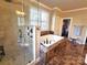 Elegant bathroom featuring a soaking tub, glass-enclosed shower, and modern fixtures at 720 9Th Nw Ave, Hickory, NC 28601