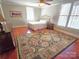 Bedroom featuring a decorative rug and multiple windows at 720 9Th Nw Ave, Hickory, NC 28601