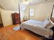 Bedroom with wood floors, window with shutters, four-poster bed and a chest of drawers at 720 9Th Nw Ave, Hickory, NC 28601