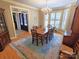 Formal dining room with a large window, chandelier, and hardwood flooring at 720 9Th Nw Ave, Hickory, NC 28601