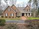 Inviting brick home with mature landscaping and a paved driveway at 720 9Th Nw Ave, Hickory, NC 28601