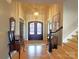 Grand foyer featuring hardwood floors, a chandelier, and a decorative front door at 720 9Th Nw Ave, Hickory, NC 28601