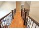Second story hallway with wrought iron railings and hardwood floors at 720 9Th Nw Ave, Hickory, NC 28601