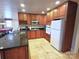 Charming kitchen boasts warm wood cabinetry, granite counters, and stainless steel appliances at 720 9Th Nw Ave, Hickory, NC 28601