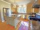 Bright kitchen with a center island, custom cabinets, and stainless steel appliances at 720 9Th Nw Ave, Hickory, NC 28601