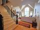 Bright living room featuring a vaulted ceiling, large windows, fireplace, and access to the outdoors at 720 9Th Nw Ave, Hickory, NC 28601