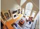 Bright living room with vaulted ceiling, fireplace, hardwood floors, and large arched window with wooded view at 720 9Th Nw Ave, Hickory, NC 28601