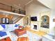 Open living room featuring vaulted ceilings, fireplace, and hardwood floors at 720 9Th Nw Ave, Hickory, NC 28601