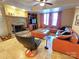 Cozy living room featuring a stone fireplace, leather furniture, and tiled floors at 720 9Th Nw Ave, Hickory, NC 28601