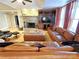 This living room features a stone fireplace, built-in shelves, and an oversized sectional sofa at 720 9Th Nw Ave, Hickory, NC 28601