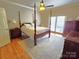 Spacious main bedroom featuring a four-poster bed, ample natural light, and hardwood floors at 720 9Th Nw Ave, Hickory, NC 28601