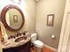 Elegant powder room boasts a vessel sink, granite countertop, and stylish round mirror at 720 9Th Nw Ave, Hickory, NC 28601