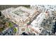 Aerial view showcasing building architecture with inner courtyard pool, parking, and surrounding landscape at 720 Governor Morrison St # 207, Charlotte, NC 28211