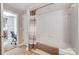 Hallway bathroom featuring a shower-tub combo with grey tiled flooring at 720 Governor Morrison St # 207, Charlotte, NC 28211