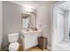 Bathroom featuring a toilet, vanity with modern fixtures, and neutral paint at 720 Governor Morrison St # 207, Charlotte, NC 28211