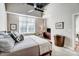 Inviting bedroom with large window, ceiling fan, hardwood floors, and contemporary furnishings at 720 Governor Morrison St # 207, Charlotte, NC 28211